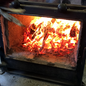 Wood-fired syrup evaporator